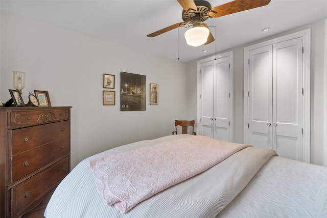 bedroom featuring ceiling fan and a closet