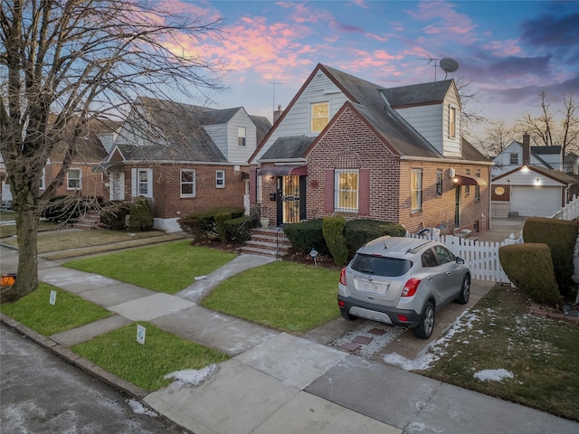 view of front facade with a garage and a lawn