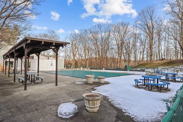 view of swimming pool with fence, a fenced in pool, and a patio