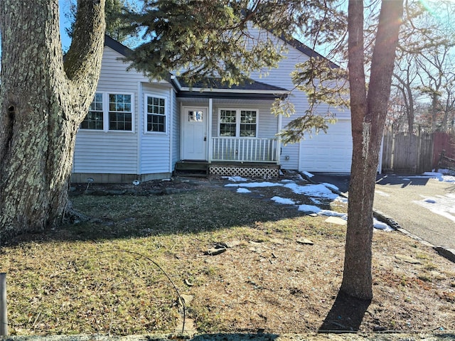 view of front of property with a garage and a front lawn