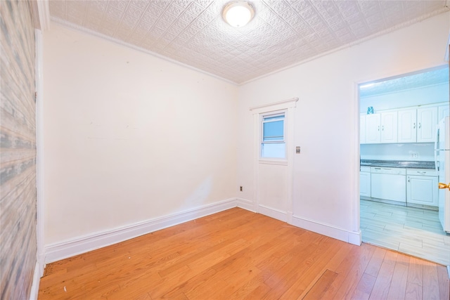 spare room featuring light wood-type flooring