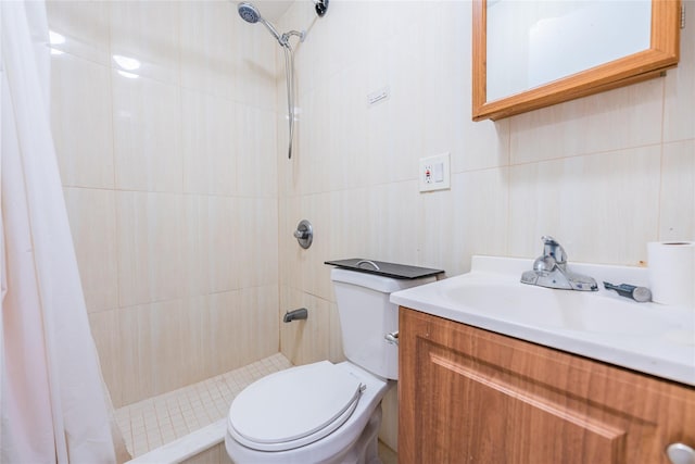 bathroom with vanity, toilet, and walk in shower