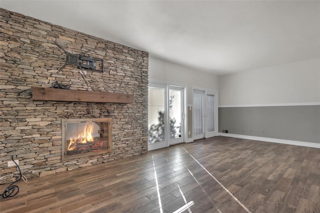 unfurnished living room featuring dark hardwood / wood-style floors