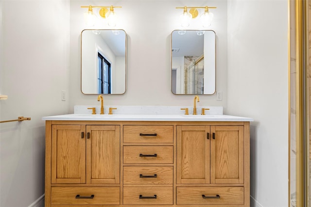 bathroom featuring vanity and a shower with door