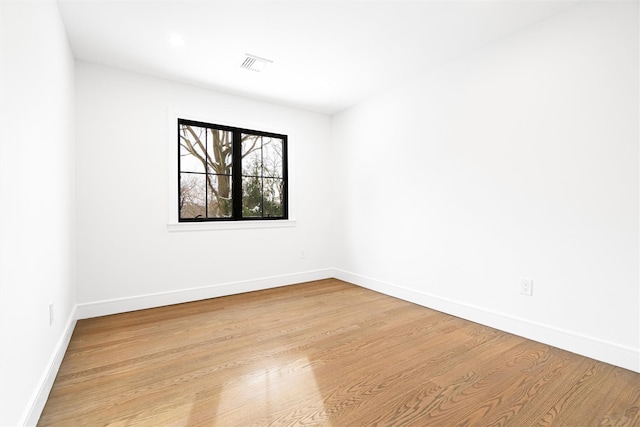 spare room with light hardwood / wood-style floors