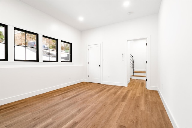 unfurnished room featuring light hardwood / wood-style floors