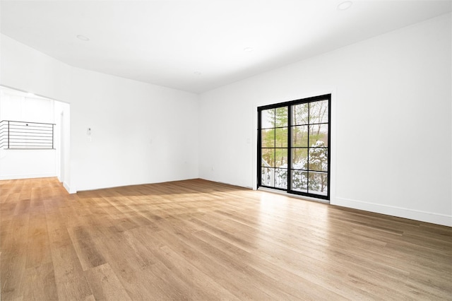 empty room with light hardwood / wood-style floors