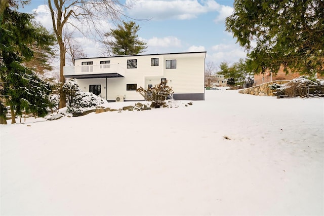 view of snow covered house