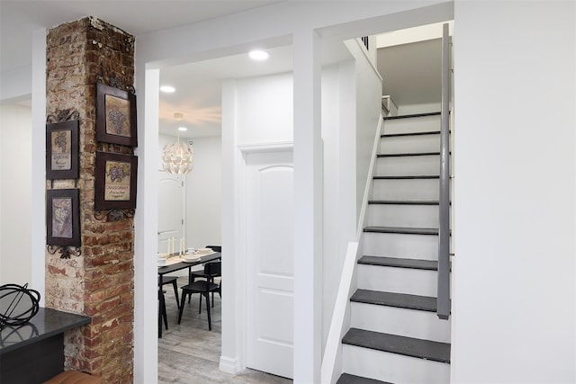 stairs with hardwood / wood-style flooring