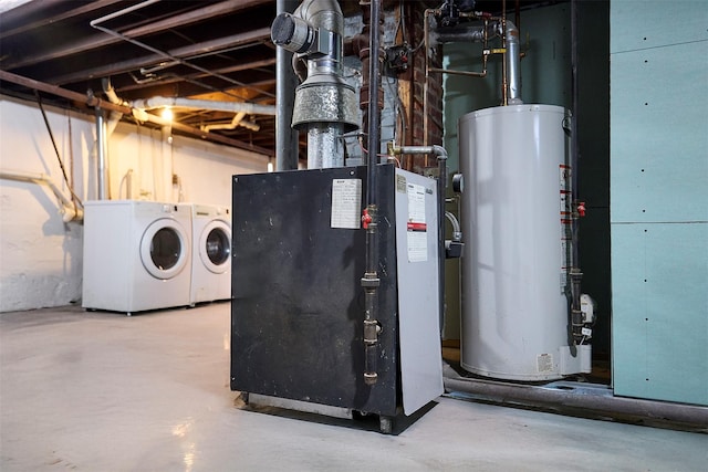 utilities featuring gas water heater, heating unit, and washing machine and clothes dryer