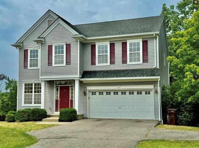 view of front of property featuring a garage