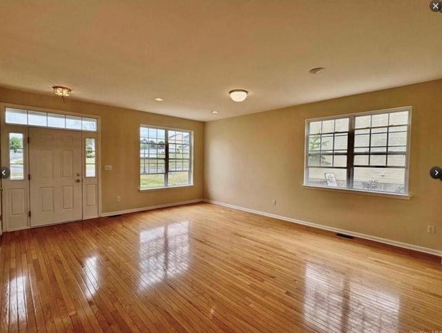 foyer entrance with light wood-type flooring