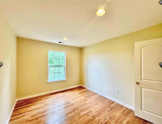 unfurnished room featuring light hardwood / wood-style floors