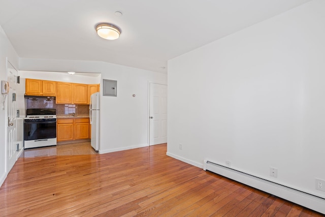 kitchen with light wood-type flooring, baseboard heating, electric panel, white appliances, and decorative backsplash