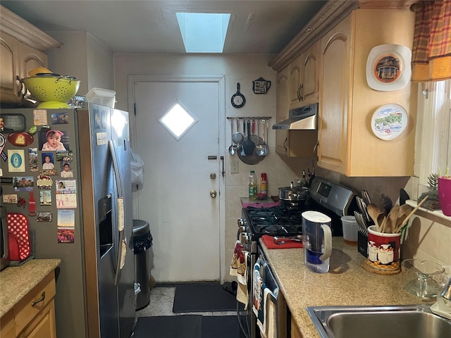 kitchen featuring light countertops, stainless steel refrigerator with ice dispenser, range, and under cabinet range hood