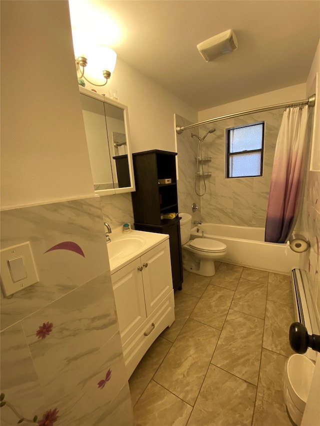 full bathroom with vanity, toilet, shower / bath combo with shower curtain, and tile walls