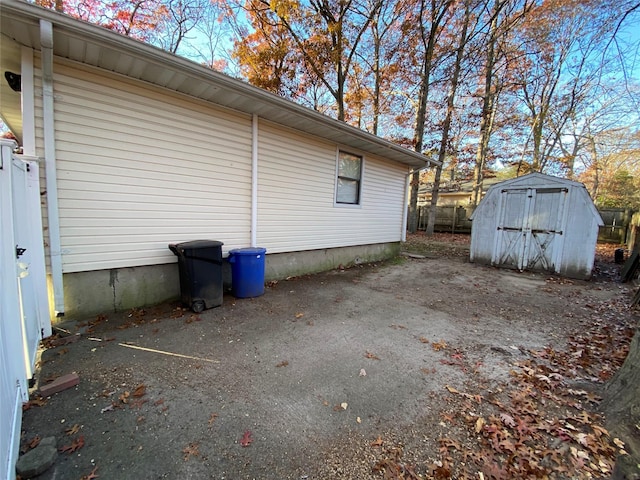 view of property exterior featuring a storage shed