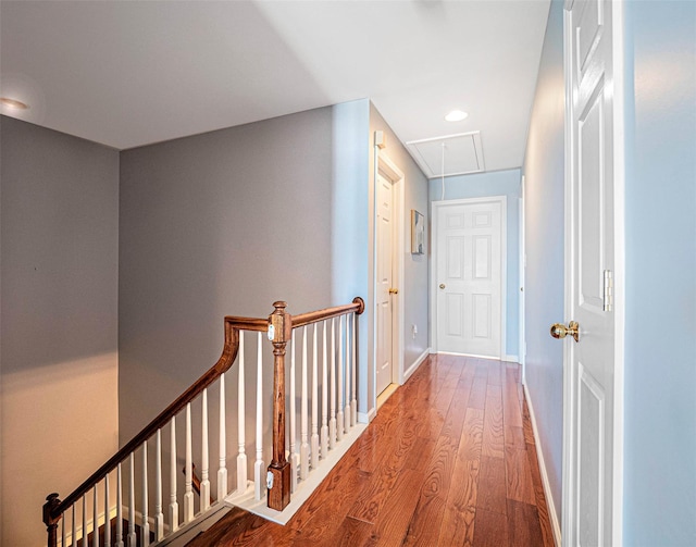 hallway with hardwood / wood-style flooring