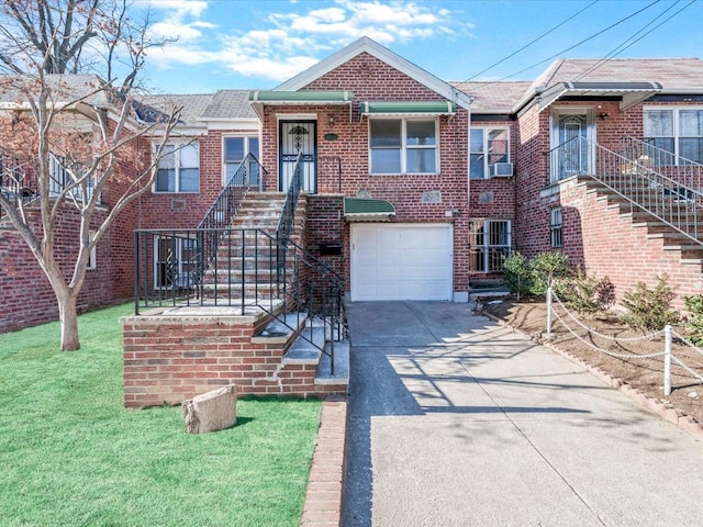 view of front of property featuring a garage and a front lawn