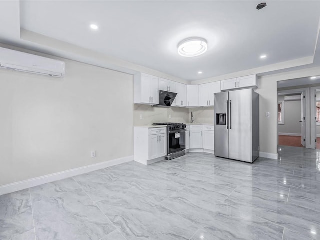 kitchen featuring a wall unit AC, ventilation hood, white cabinets, range with gas cooktop, and high end refrigerator