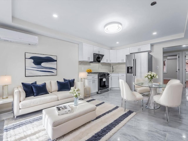 living room featuring an AC wall unit