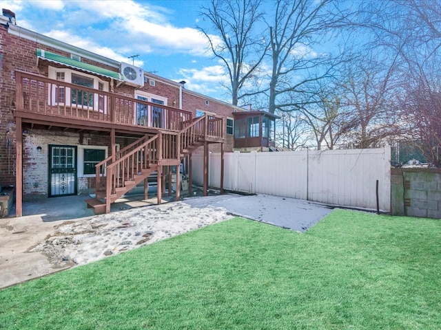 view of yard featuring a wooden deck, central AC unit, and a patio