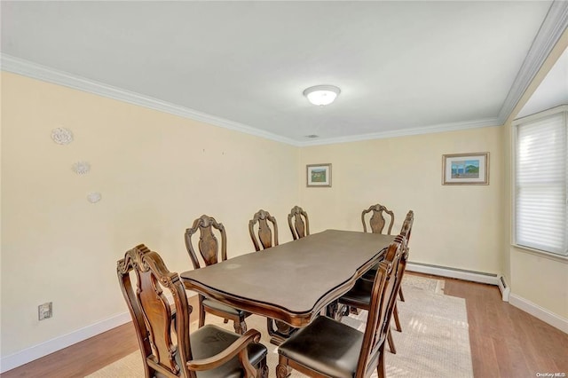 dining area with a baseboard radiator, crown molding, and light hardwood / wood-style flooring