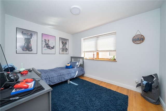 bedroom featuring hardwood / wood-style flooring