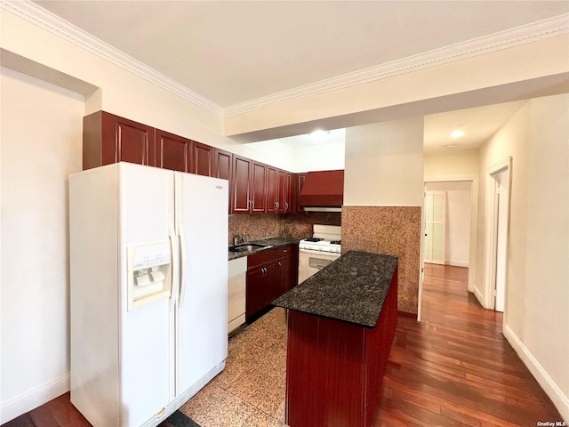 kitchen with premium range hood, a kitchen island, sink, crown molding, and white appliances