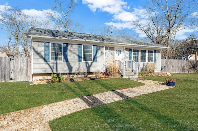 single story home featuring a front lawn