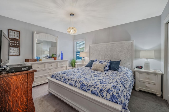 bedroom with dark colored carpet