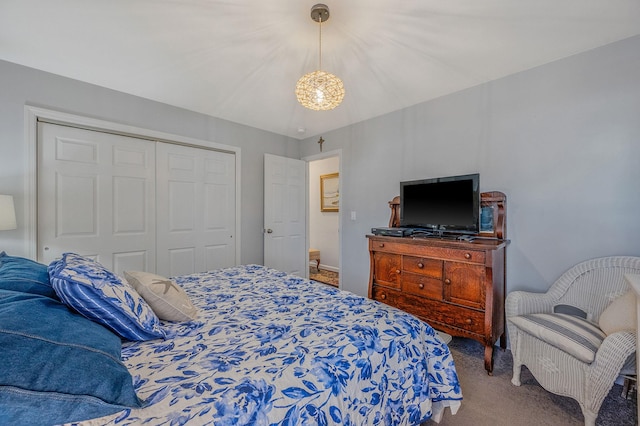 carpeted bedroom with a closet