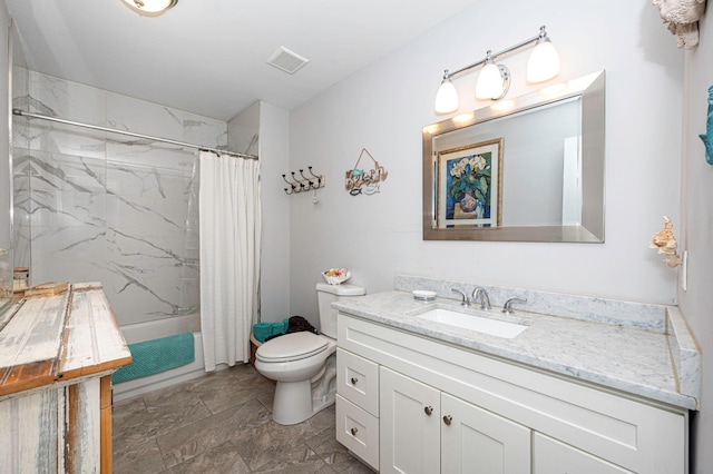 full bathroom featuring vanity, shower / bath combination with curtain, and toilet