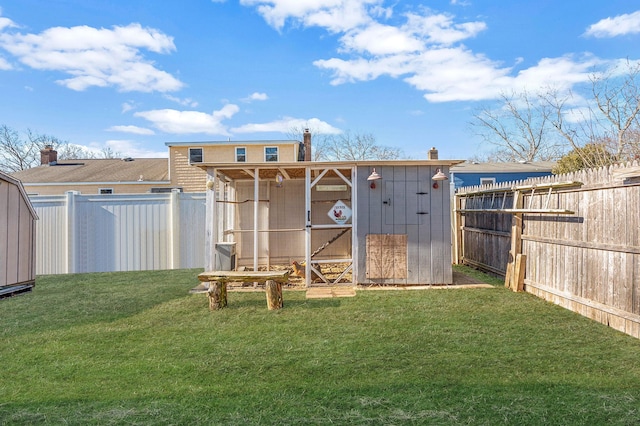 exterior space with an outbuilding and a lawn