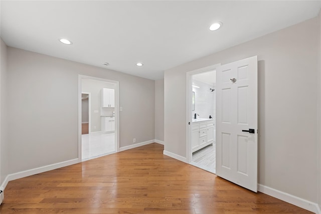 spare room with light hardwood / wood-style flooring