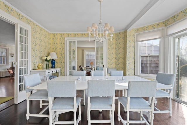 dining area with an inviting chandelier, dark wood-type flooring, and french doors