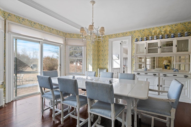 dining room with dark wood-type flooring and a chandelier