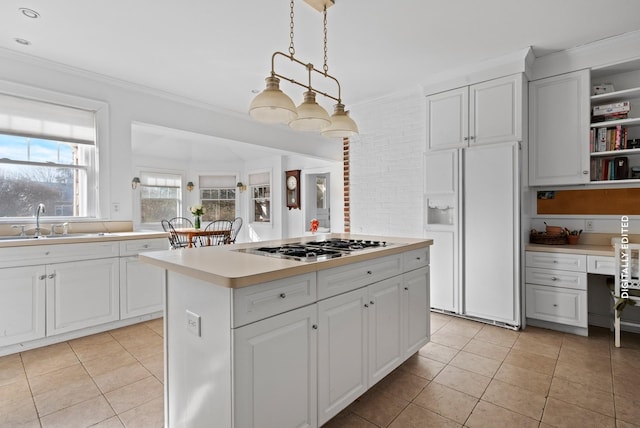 kitchen featuring sink, white cabinetry, hanging light fixtures, a center island, and white refrigerator with ice dispenser