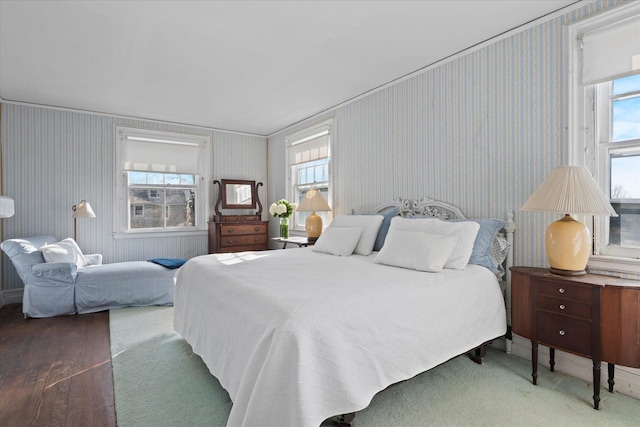 bedroom with dark hardwood / wood-style flooring