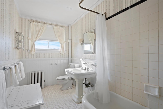 bathroom featuring ornamental molding, radiator heating unit, shower / bath combination with curtain, and toilet