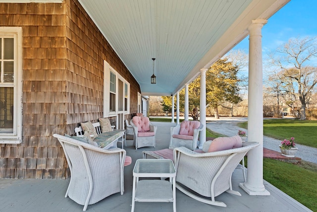 view of patio featuring a porch