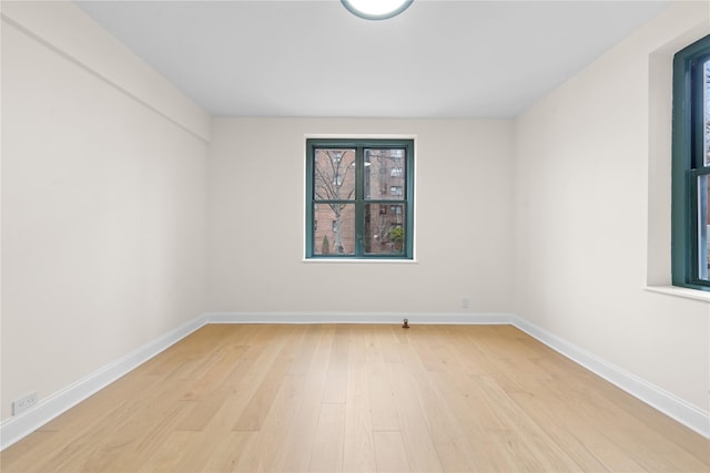 spare room featuring light hardwood / wood-style floors