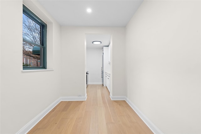 hall with light hardwood / wood-style floors