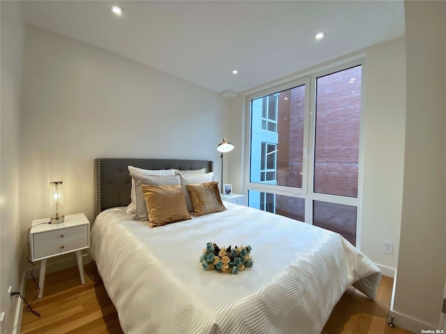 bedroom featuring hardwood / wood-style flooring