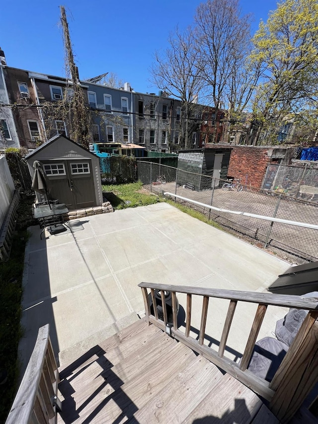 view of patio with a storage unit