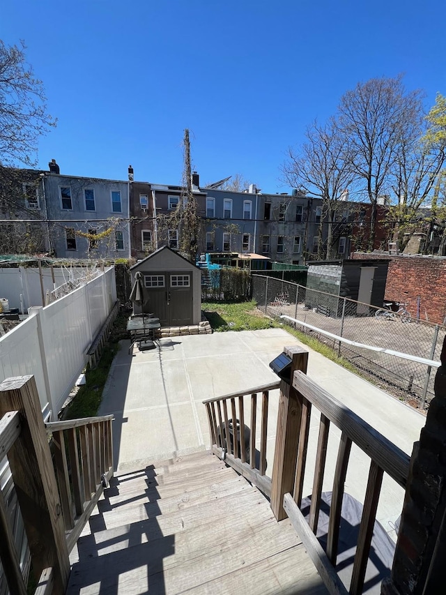 view of patio with a storage unit