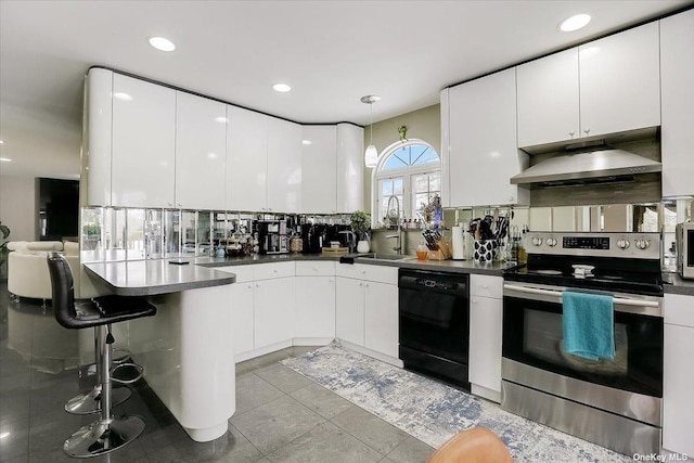 kitchen with appliances with stainless steel finishes, sink, extractor fan, and white cabinets