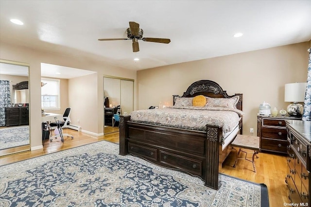 bedroom with ceiling fan and light hardwood / wood-style floors