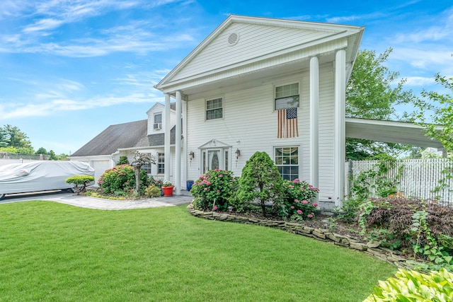 view of front of home with a garage and a front yard