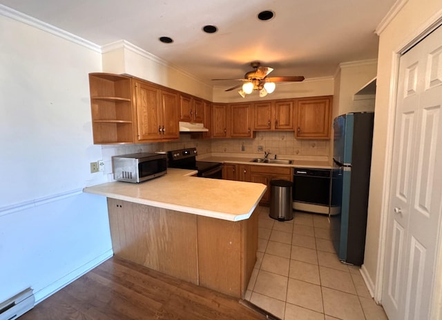 kitchen with sink, black appliances, ornamental molding, a baseboard radiator, and kitchen peninsula